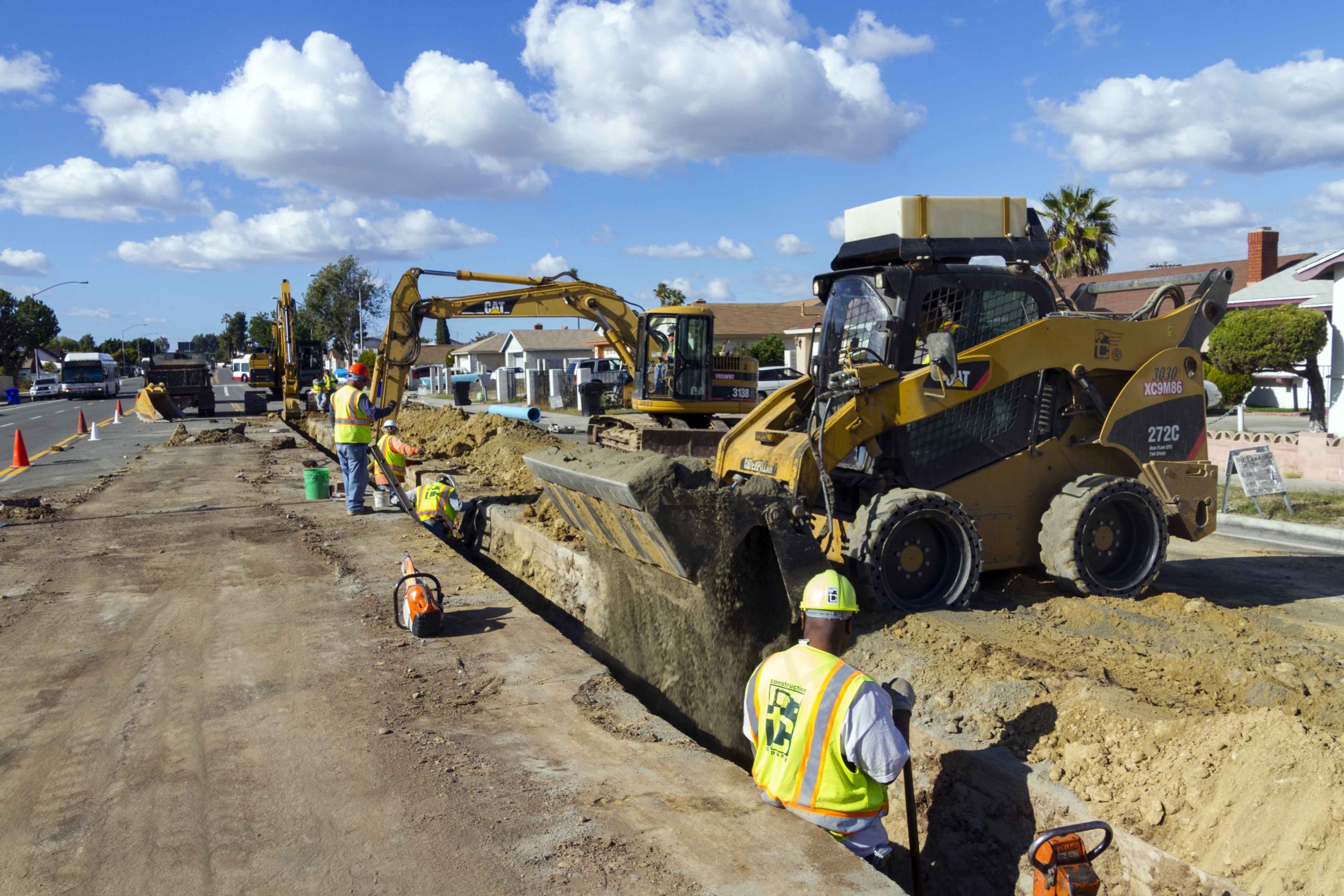 MACC Task Order No 1 AC Water & Sewer Group 949 and 946 - filling trench with machines and workers