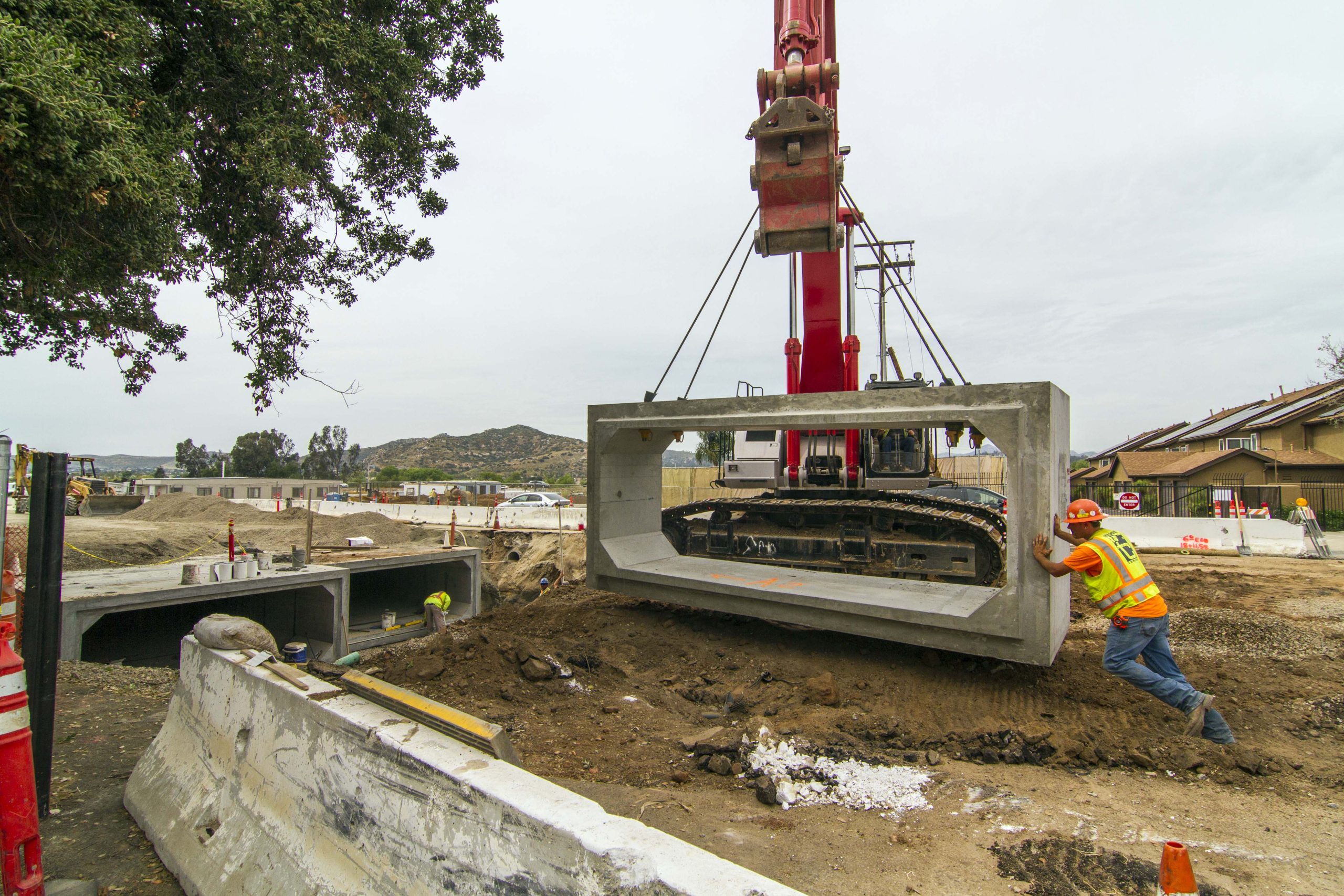 Woodside Ave Flood Control moving box culverts into place
