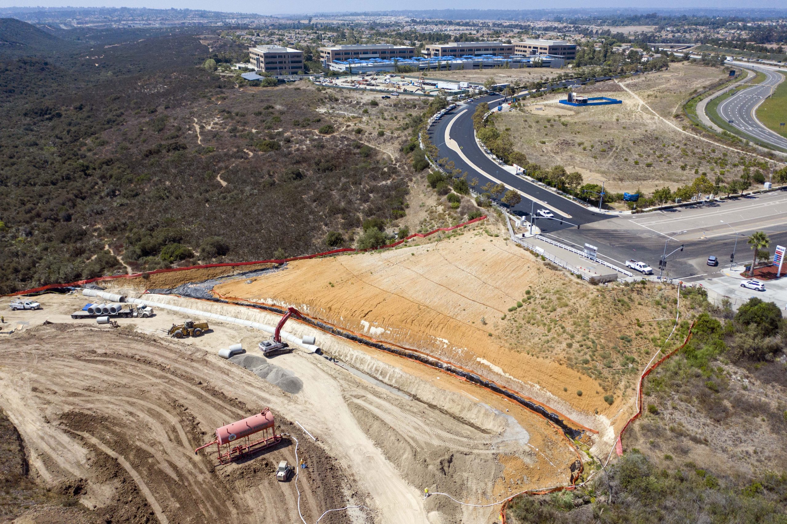 Merge 56 overhead view of pipeline work near streets and buildings