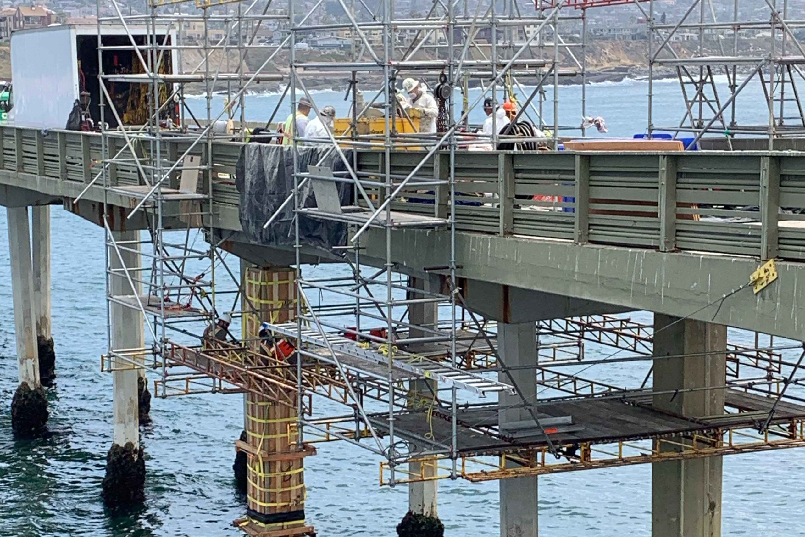 Ocean Beach Pier Emergency Repair workers and scaffolding