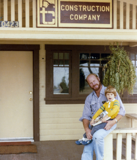 Terry Cameron and son Austin in 1981 on the porch of the first TC Construction Company office
