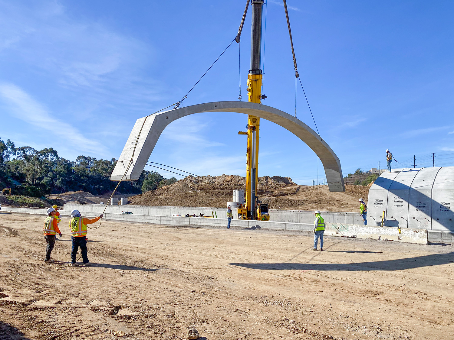3 Roots by Lennar project site in Mira Mesa, San Diego - Placing Conspan precast bridge section