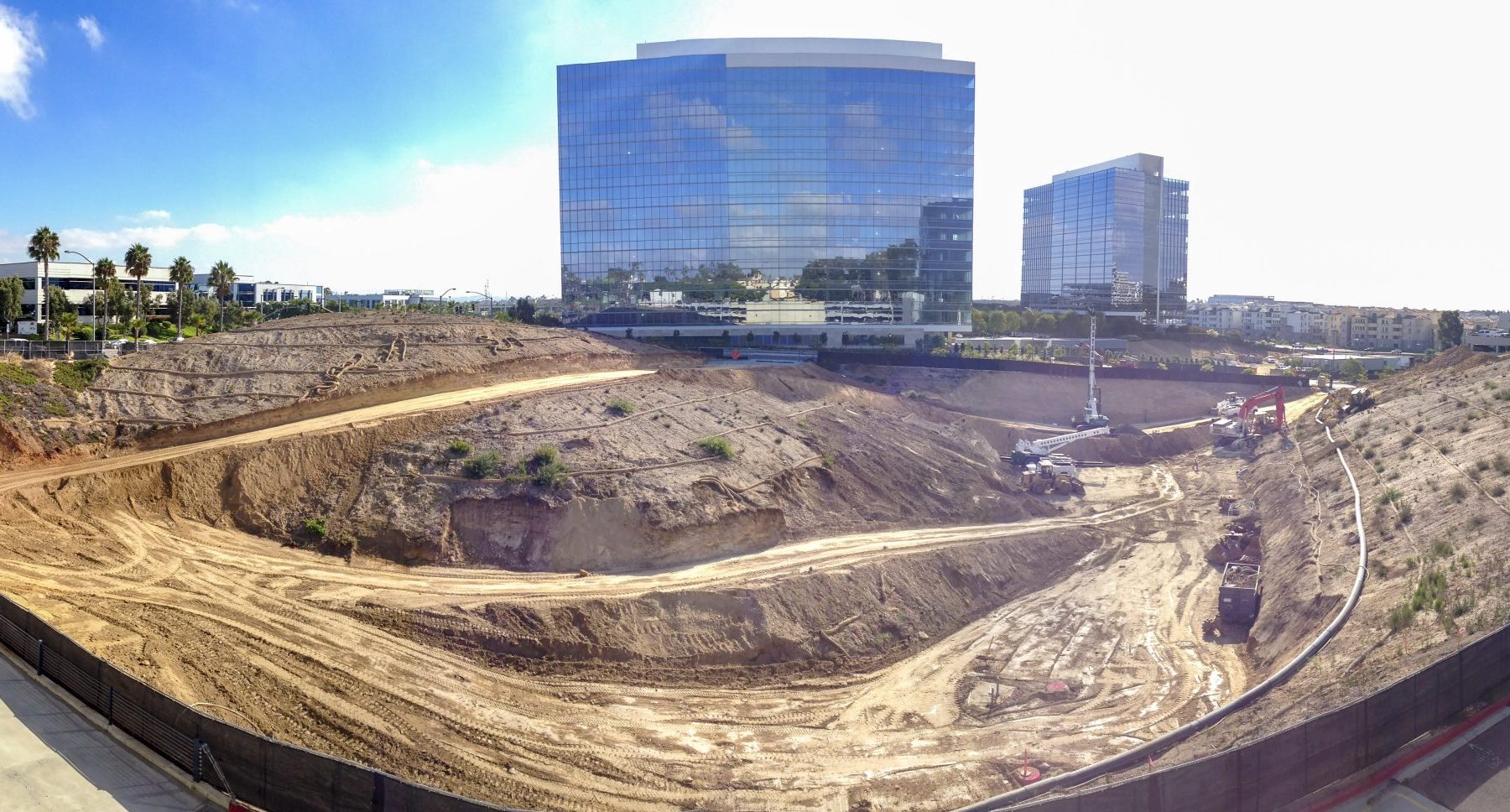 13-022 La Jolla Centre III Deep Sewer, aerial view of excavation for utility infrastructure under large office building