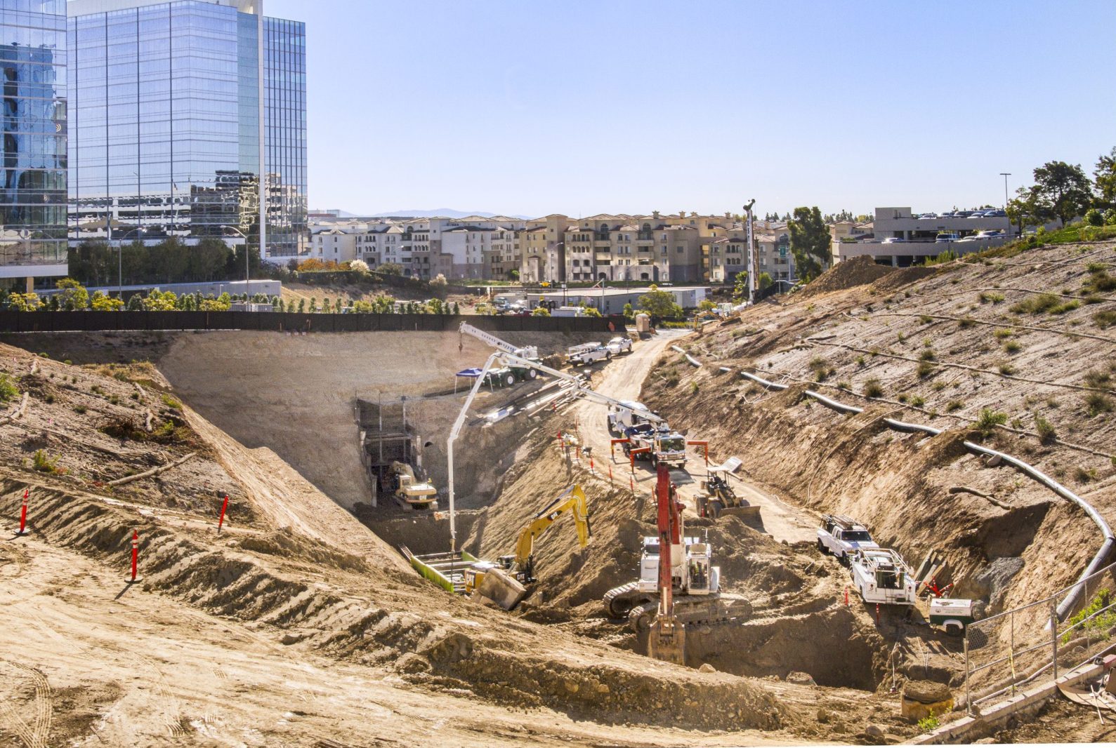 13-022 La Jolla Centre III Deep Sewer, aerial view of excavation for utility infrastructure under large office building