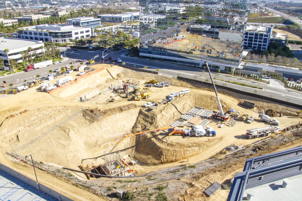 13-022 La Jolla Centre III Deep Sewer, aerial view of excavation for utility infrastructure under large office building