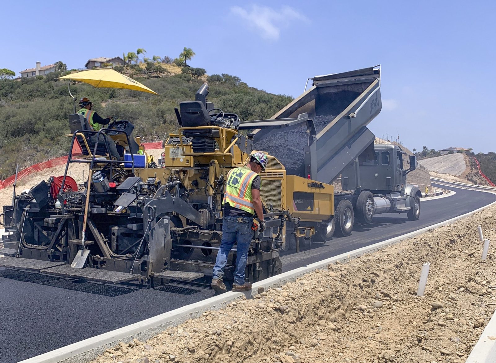20007 Merge 56 paving crew and machines laying asphalt