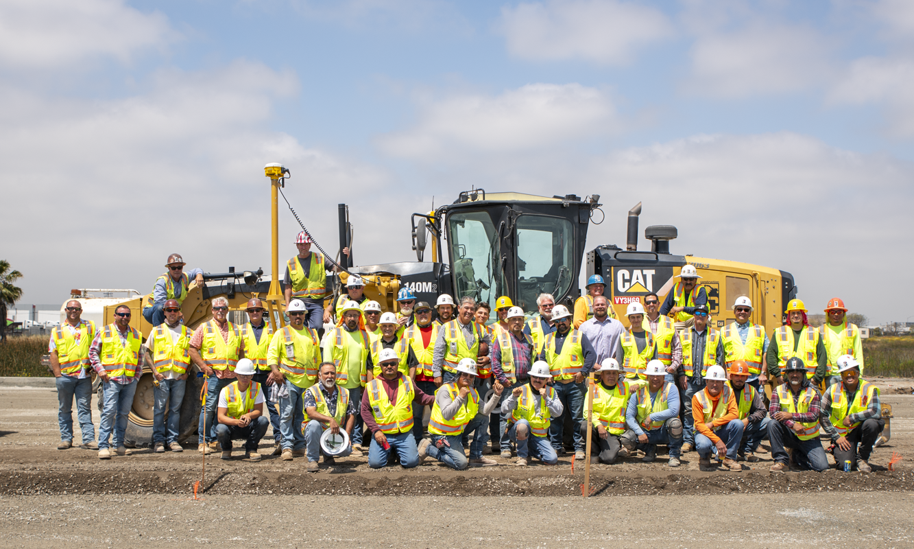 Group of employees and supervisors gathered for a group picture at La Media jobsite